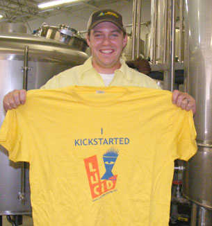 Lucid owner, Jon Messier poses with one of their Kickstarter rewards.